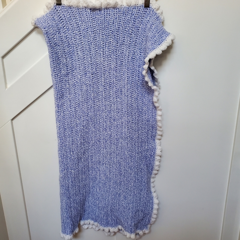 Crocheted blue and white baby blanket